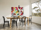 Petal Drift floral canvas print on the wall of a dining room