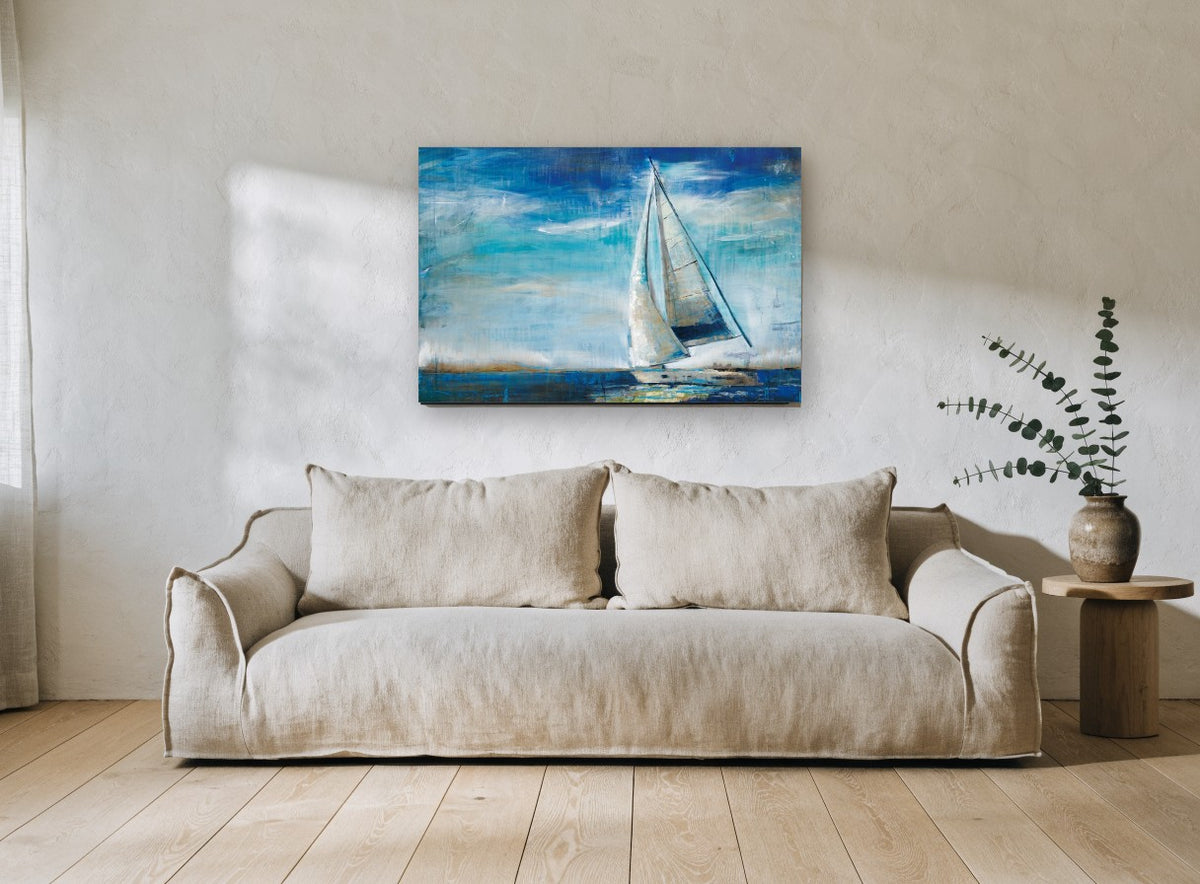 Sails Into Blue coastal canvas print on the wall of a living room