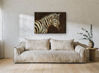 Zebra in Dark Amber animal canvas print on the wall of a living room
