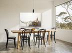 Longhorn Gaze animal canvas print on the wall of a dining room