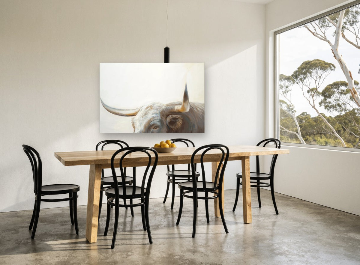 Longhorn Gaze animal canvas print on the wall of a dining room