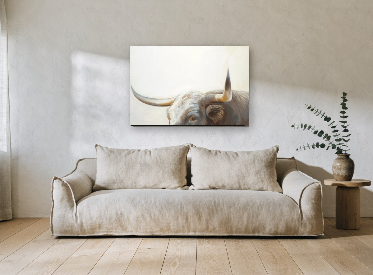 Longhorn Gaze animal canvas print on the wall of a living room