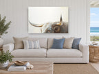 Longhorn Gaze animal canvas print on the wall of a beach house living room