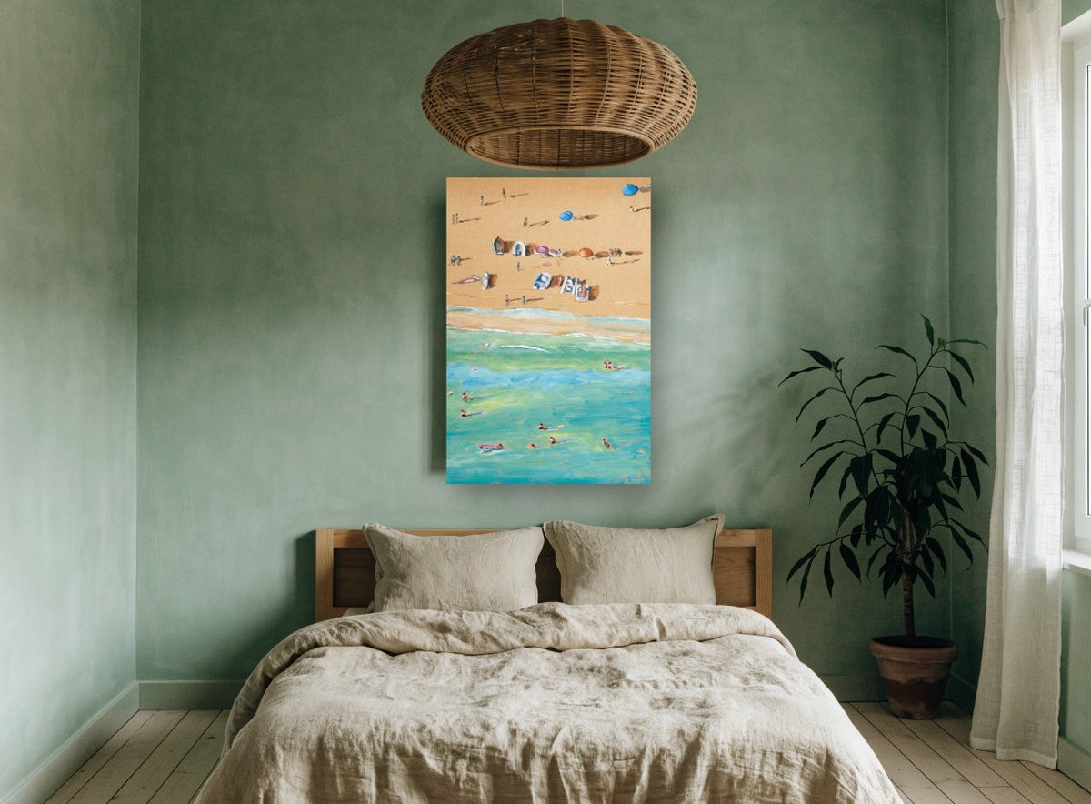 Sand and Swimmers Above coastal canvas print on the wall of a bedroom