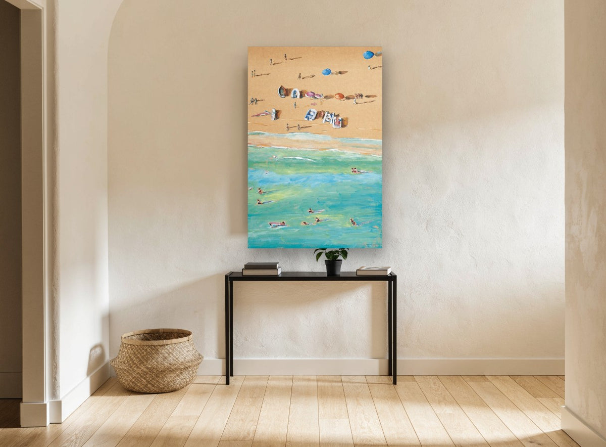 Sand and Swimmers Above coastal canvas print on the wall of a hallway