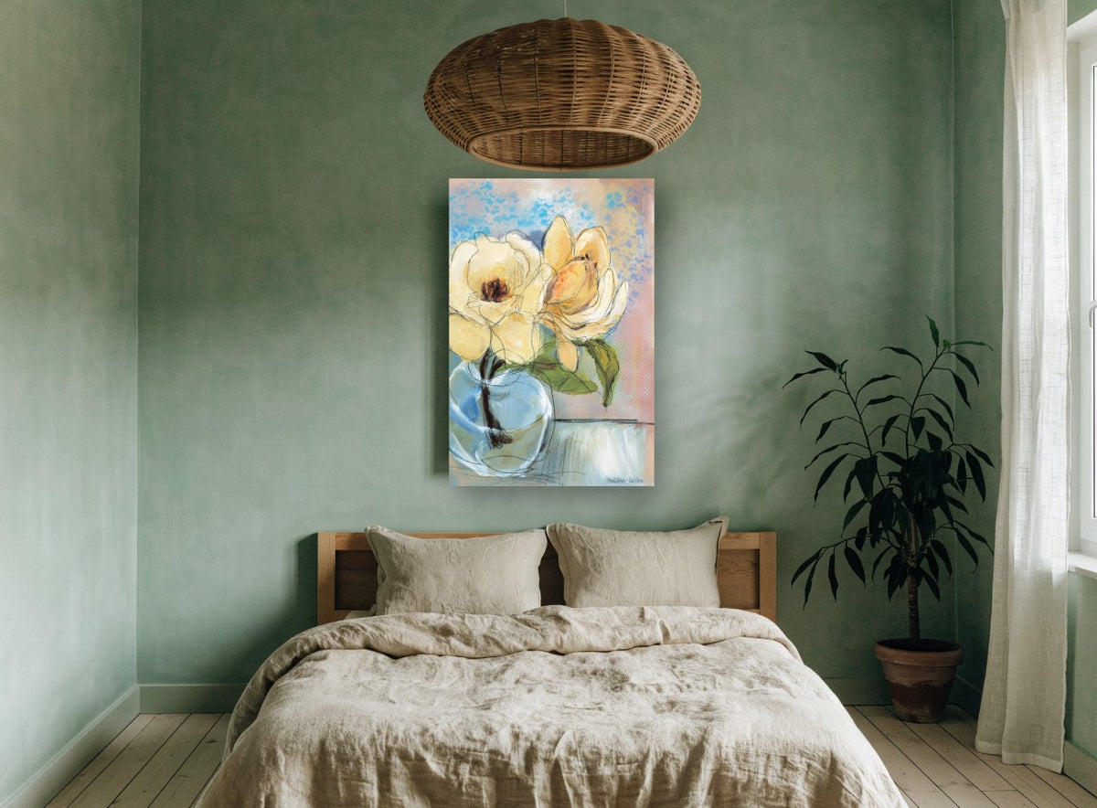 Cream Magnolia in Glass floral canvas print on the wall of a bedroom