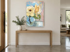 Cream Magnolia in Glass floral canvas print on the wall of a entry hall
