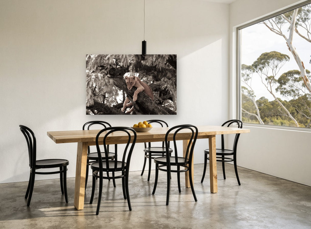 Lioness in the Branches floral canvas print on the wall of a dining room