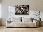 Lioness in the Branches floral canvas print on the wall of a living room