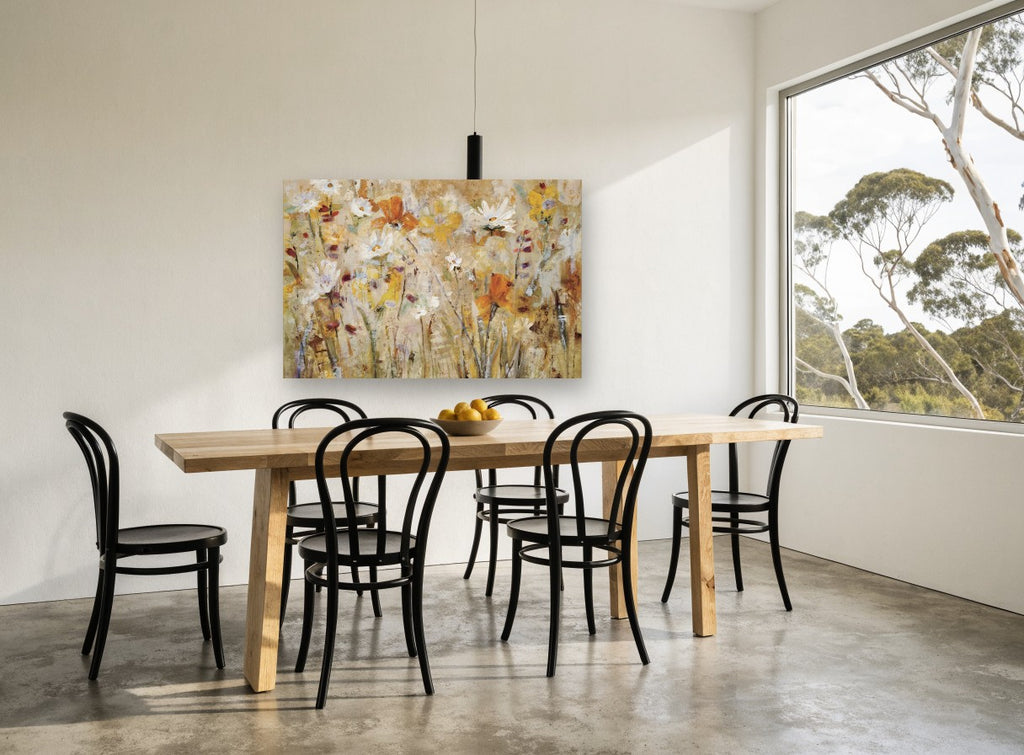 Golden Meadow Drift floral canvas print on the wall of a dining room