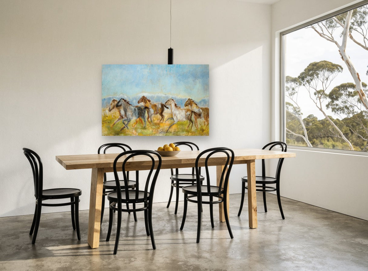 Galloping Mountain Herd animal canvas print on the wall of a dining room