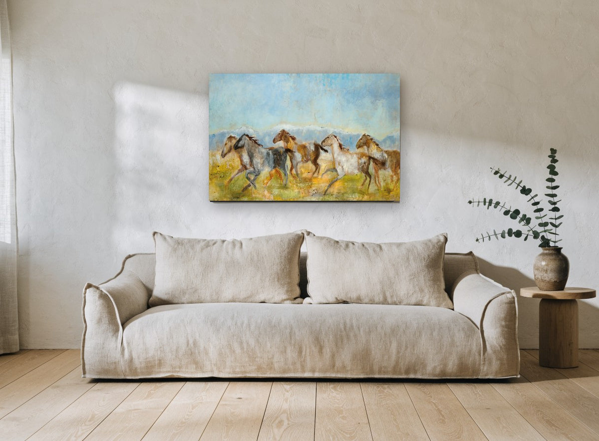 Galloping Mountain Herd animal canvas print on the wall of a living room