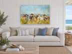 Galloping Mountain Herd animal canvas print on the wall of a beach house living room