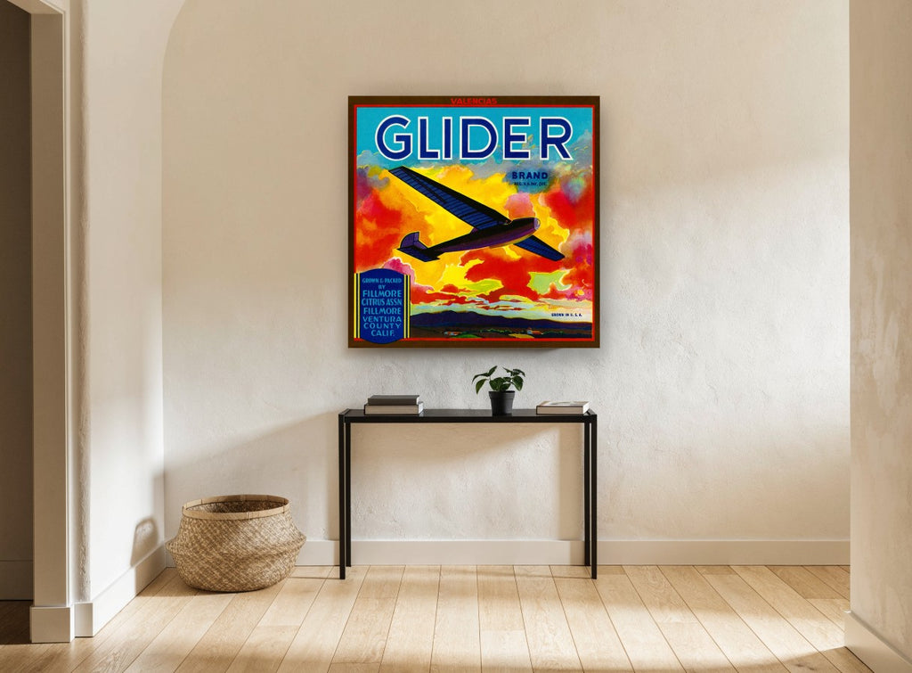 Glider Over Fiery Clouds vintage canvas print on the wall of a hallway