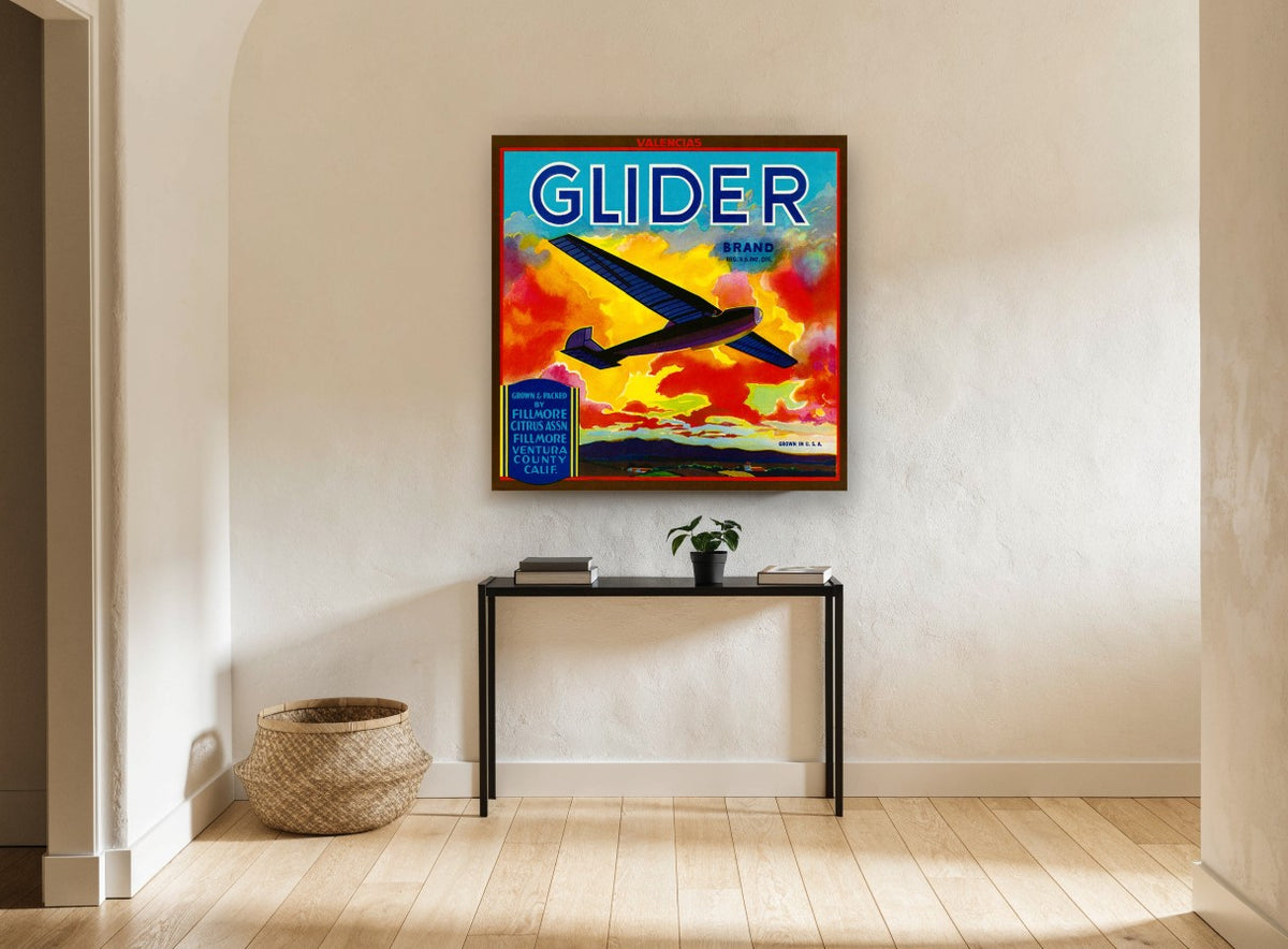 Glider Over Fiery Clouds vintage canvas print on the wall of a hallway