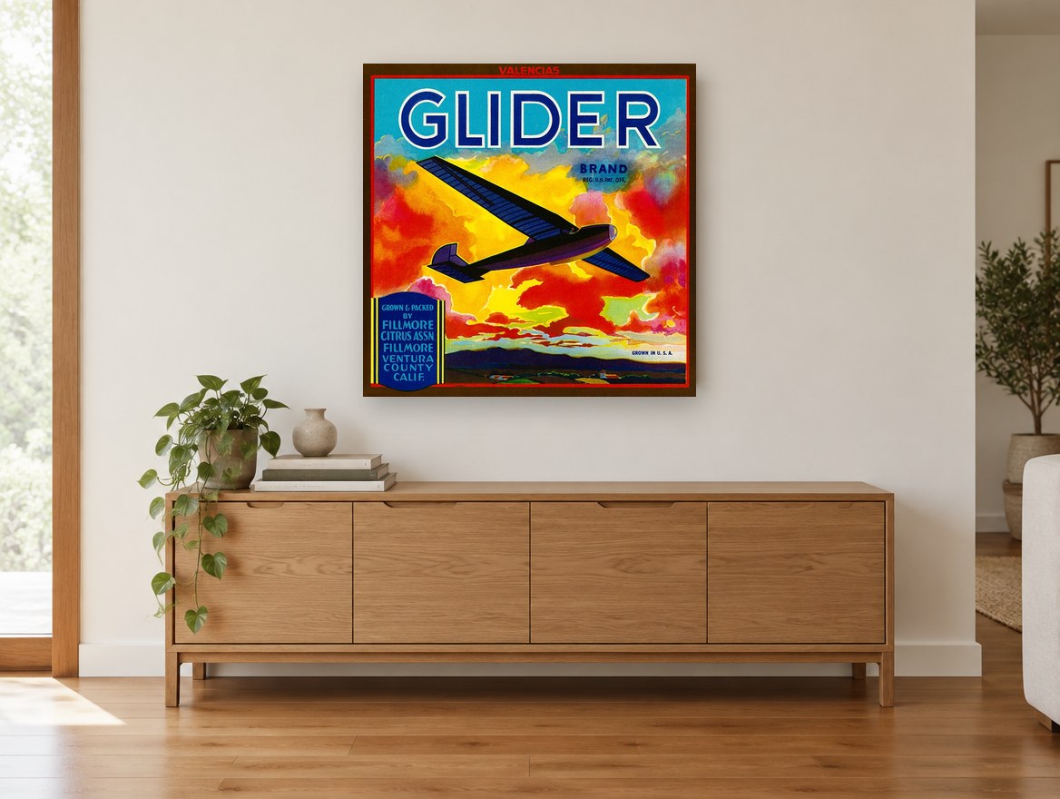 Glider Over Fiery Clouds vintage canvas print on the wall of a living room above a sideboard