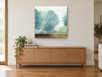 Misty Teal Grove floral canvas print on the wall of a living room above a sideboard