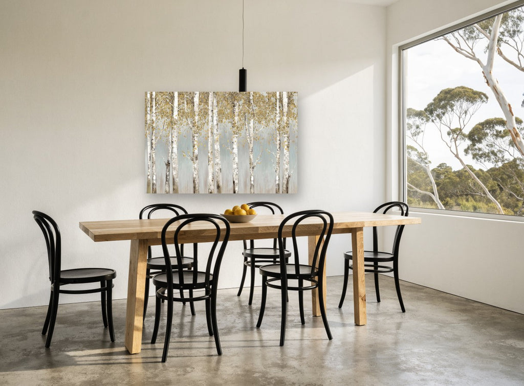 Golden Birch Haze floral canvas print on the wall of a dining room