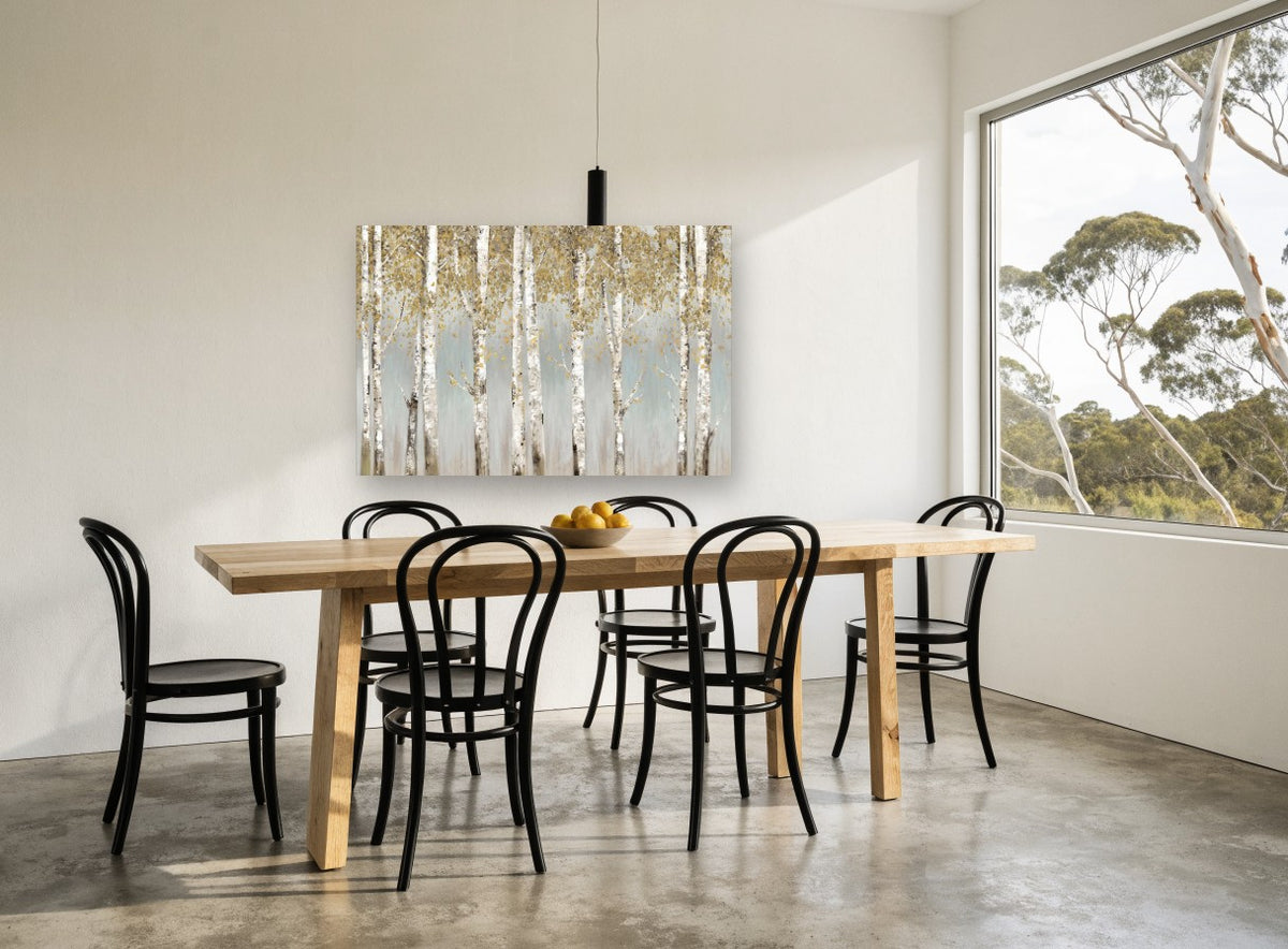 Golden Birch Haze floral canvas print on the wall of a dining room