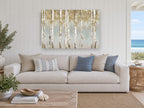 Golden Birch Haze floral canvas print on the wall of a beach house living room