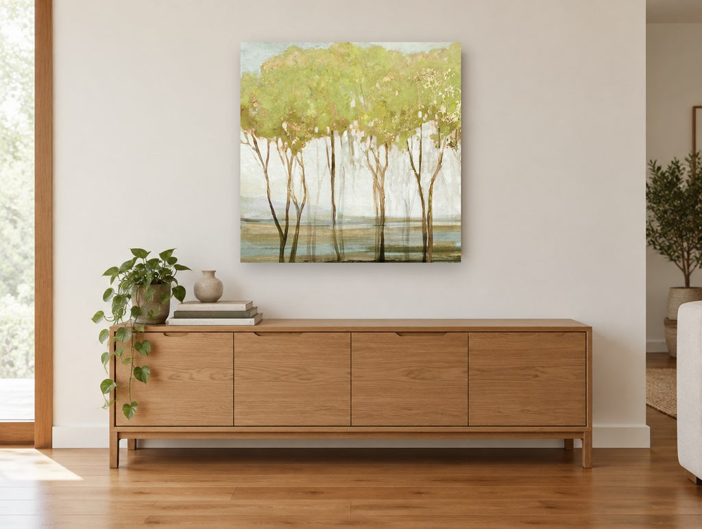 Gilded Green Grove floral canvas print on the wall of a living room above a sideboard