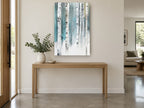 Teal Birch Stand floral canvas print on the wall of a entry hall