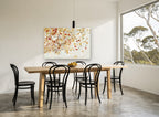 Autumn Leaves Adrift floral canvas print on the wall of a dining room