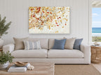 Autumn Leaves Adrift floral canvas print on the wall of a beach house living room