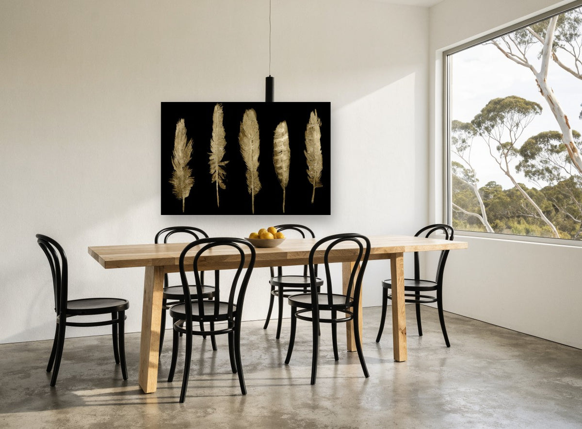 Five Gilded Feathers animal canvas print on the wall of a dining room