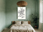 Graphite Hibiscus Study floral canvas print on the wall of a bedroom