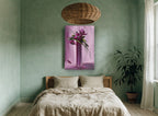 Magenta Blooms in Tall Vase floral canvas print on the wall of a bedroom