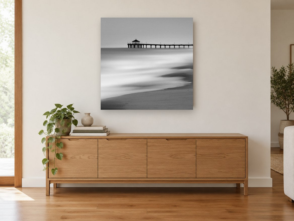 Silent Pier Haze coastal canvas print on the wall of a living room above a sideboard