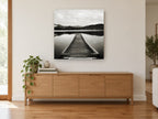 Snowcap Mirror Jetty landscape canvas print on the wall of a living room above a sideboard