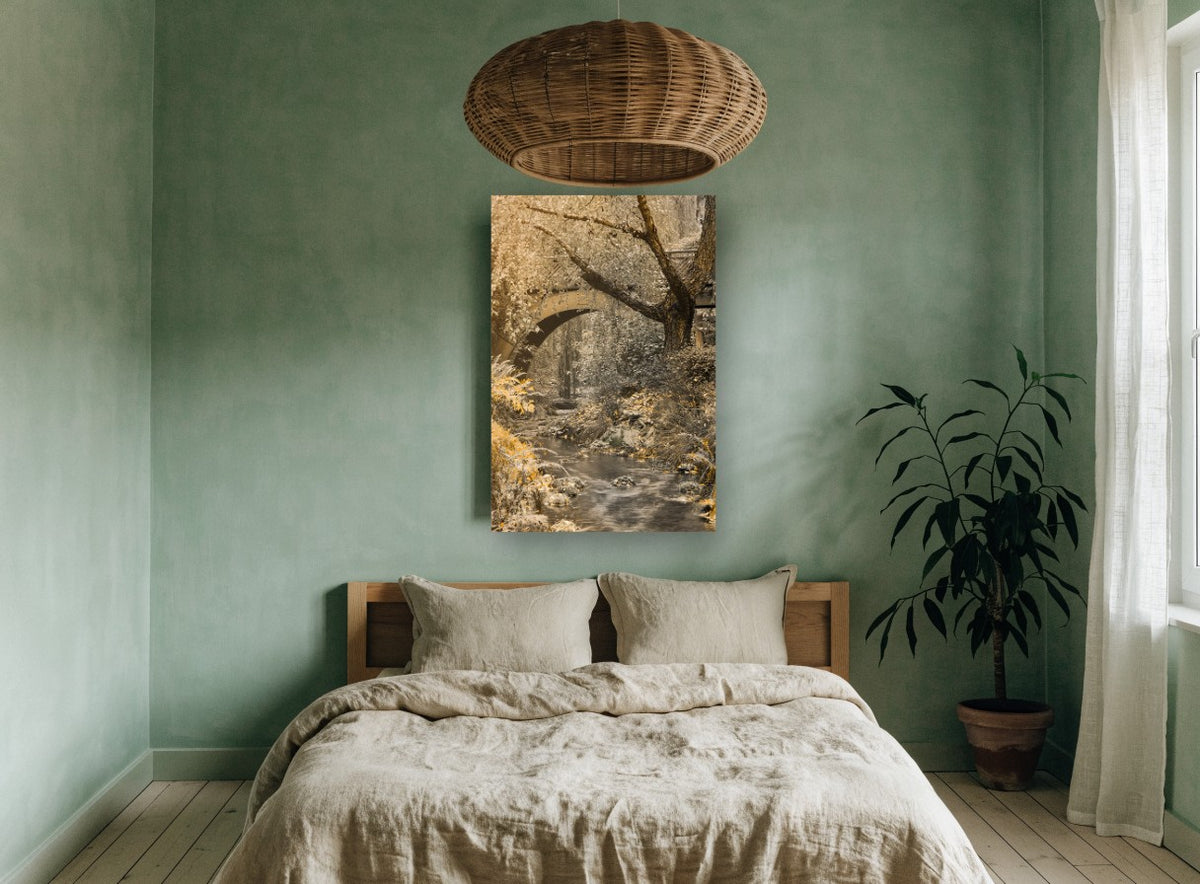 Golden Creek Bridge floral canvas print on the wall of a bedroom