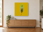 Dotted Teal Feather animal canvas print on the wall of a living room above a sideboard