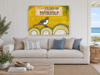Bird Finding Freedom animal canvas print on the wall of a beach house living room