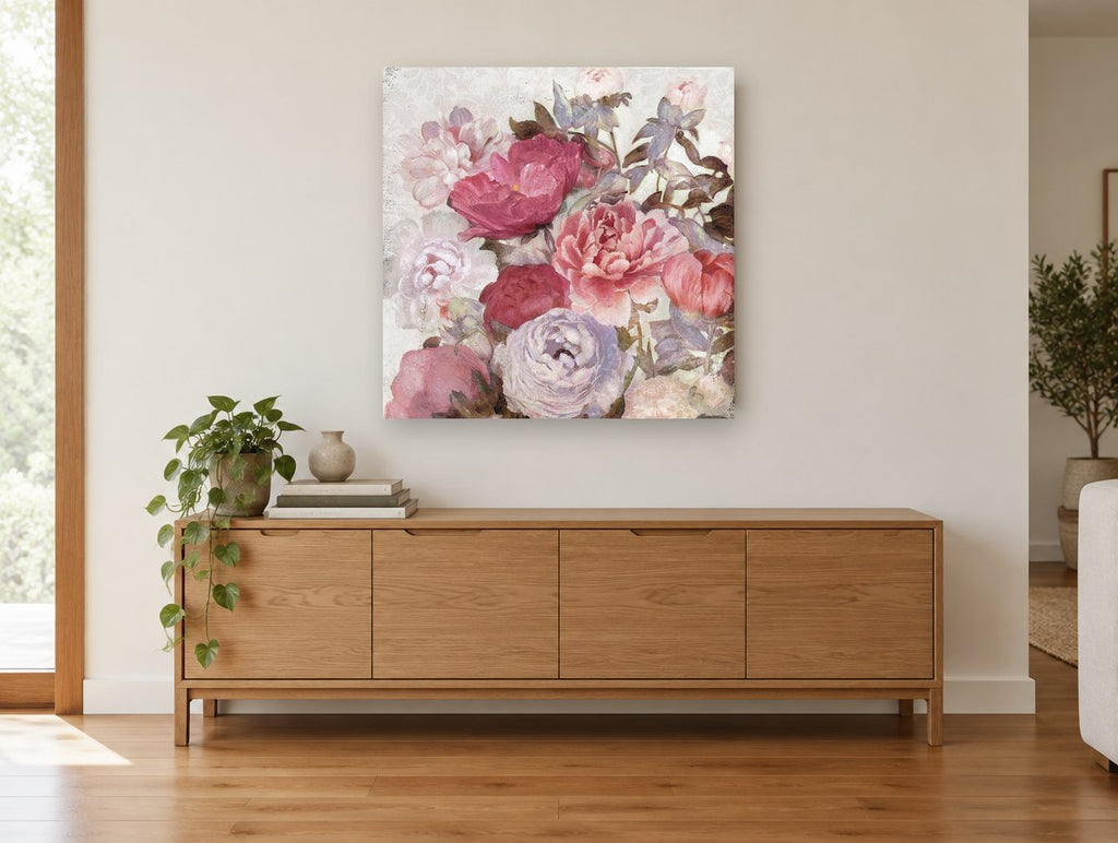 Blush Peony Bouquet floral canvas print on the wall of a living room above a sideboard