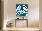 Indigo Leaf Silhouettes floral canvas print on the wall of a hallway