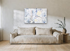 Faded Leaf Tiles floral canvas print on the wall of a living room