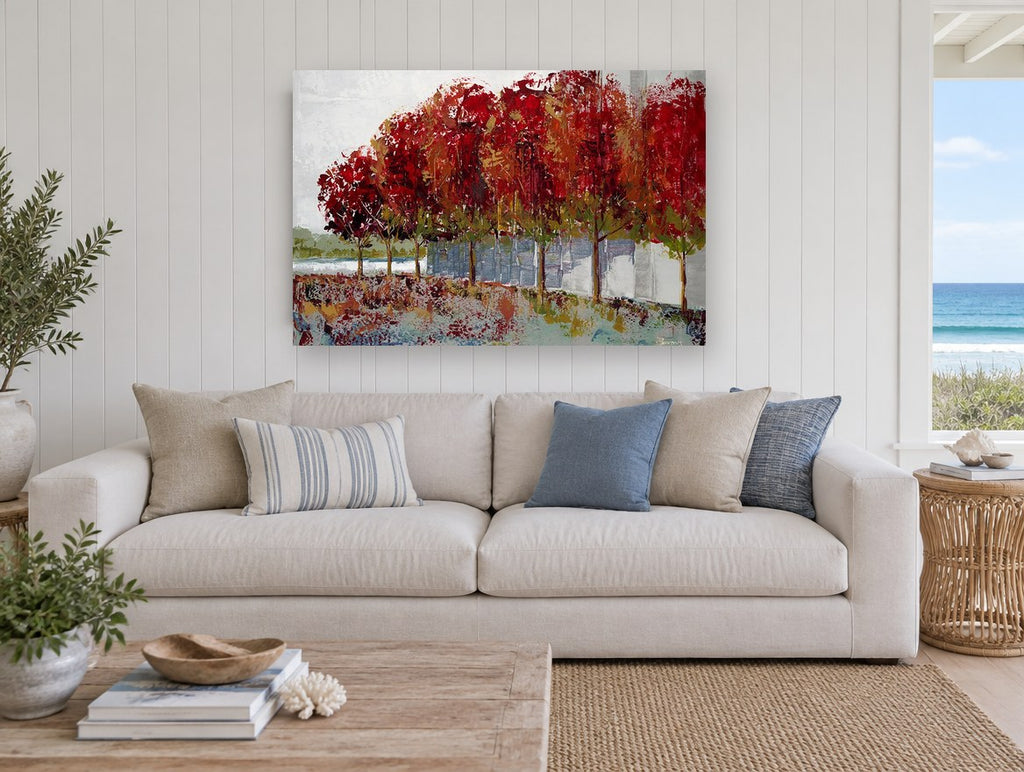 Crimson Tree Row landscape canvas print on the wall of a beach house living room