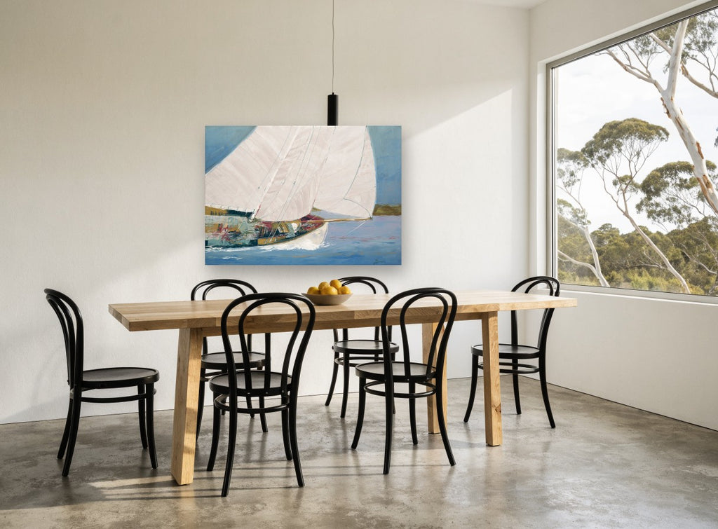 Sails Full Across Blue coastal canvas print on the wall of a dining room