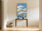 Parasols Against Blue coastal canvas print on the wall of a hallway