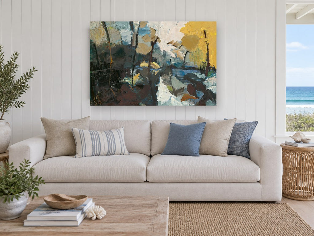 Golden Birch Thaw landscape canvas print on the wall of a beach house living room