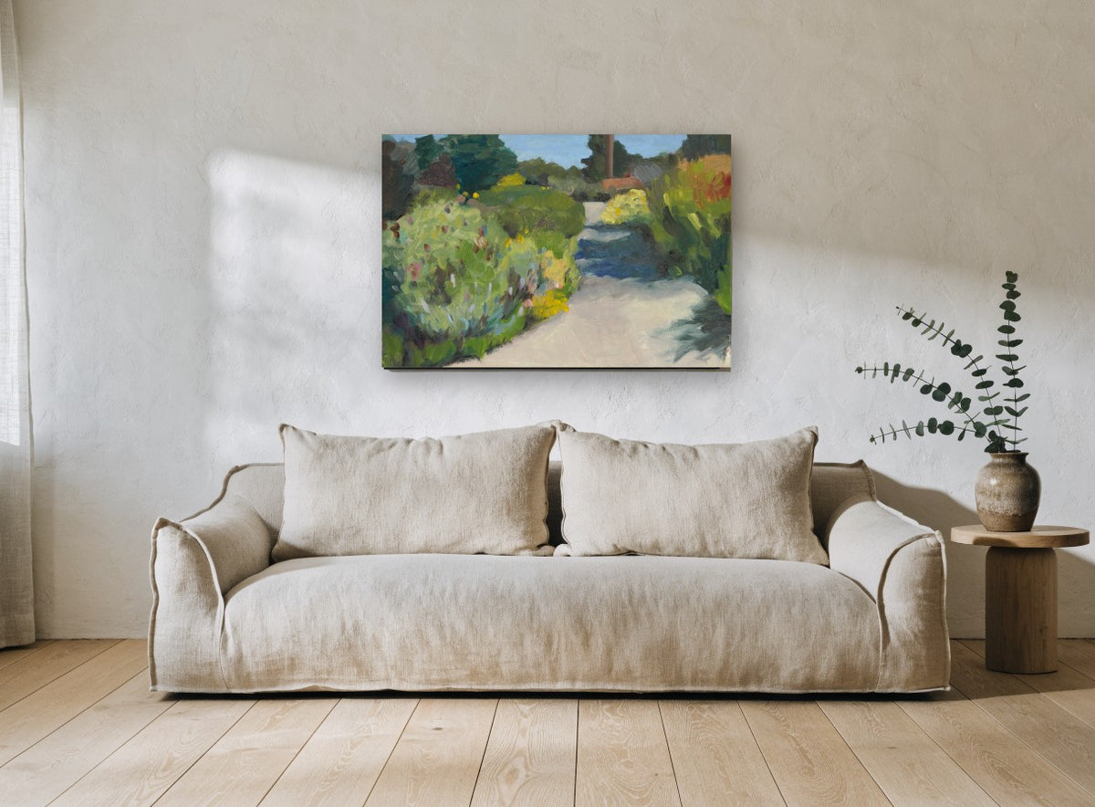 Sunlit Garden Walkway landscape canvas print on the wall of a living room