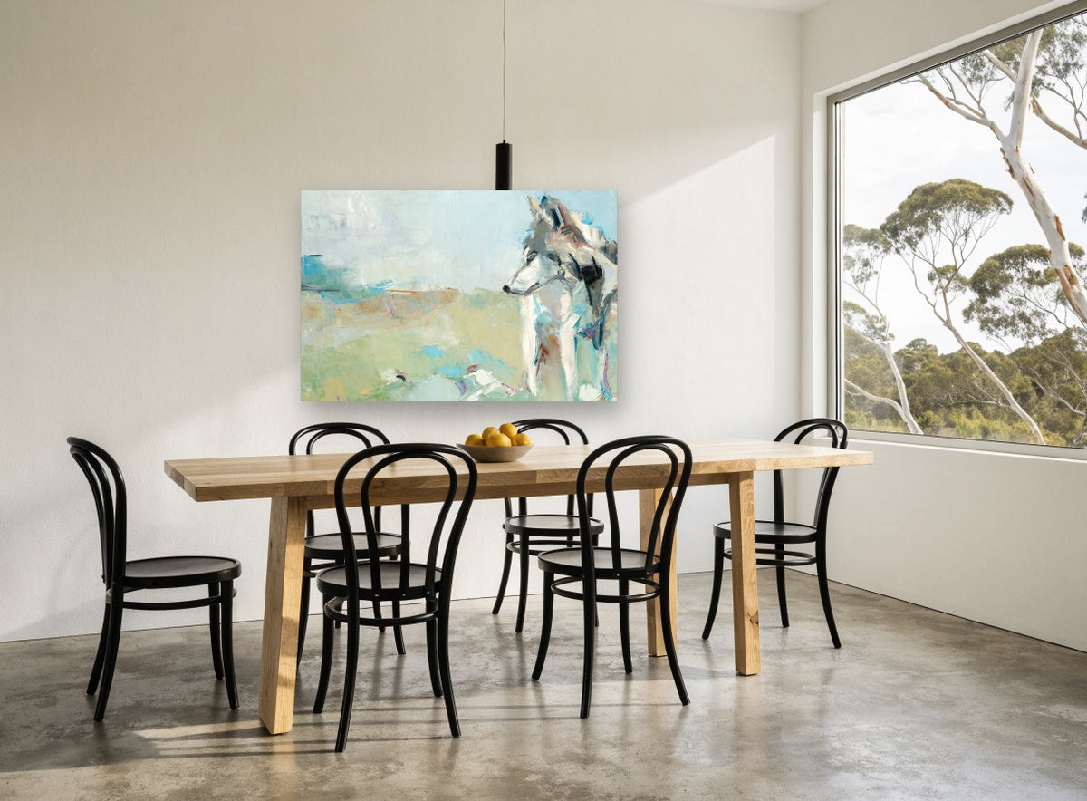 Wolf in Pale Meadow animal canvas print on the wall of a dining room