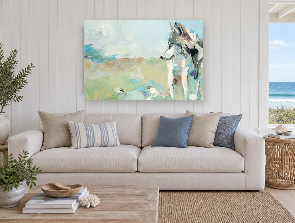 Wolf in Pale Meadow animal canvas print on the wall of a beach house living room