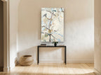 Pale Pear Branches floral canvas print on the wall of a hallway