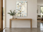 Pale Pear Branches floral canvas print on the wall of a entry hall