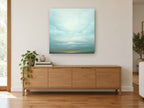 Pale Horizon Sky landscape canvas print on the wall of a living room above a sideboard