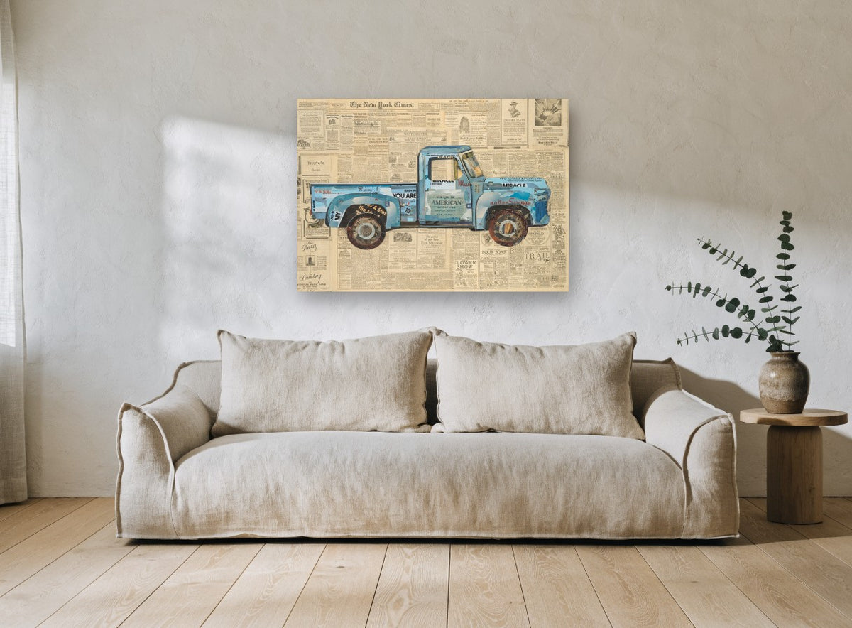 Blue Truck on Newsprint vintage canvas print on the wall of a living room